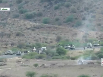 Smoke rises from a vehicle as armed men take to the streets at a location given as Khalid Camp, near Mocha, and said to show Houthi fighters firing towards government forces backed by Saudi Arabia, in Yemen, in this screengrab taken from a video released September 22, 2026. Al Masirah/Handout via REUTERS  THIS IMAGE HAS BEEN SUPPLIED BY A THIRD PARTY. TEXT OVERLAY FROM SOURCE.  REFILE - ADDED LOCATION AND CONTEXT. Verification: Reuters was able to verify the location from timecodes 0:21 to 0:28; 0:47 to 0:55; 01:42 to 01:50; 2:13 to 2:19 with the buildings, infrastructure and port layout that matched the archive and satellite imagery of the area. Location not verified from timecodes 0:00-0:20; 0:29- 0:46; 0:56-01:41; 01:51-2:12; 2:20- 3:03. The date when the videos were filmed was not verified. No old results were found posted online before September 22.