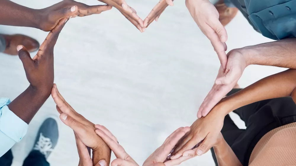 Teamwork hands, heart and diversity partnership, business people support or community care, motivation and trust. Above group team building for charity, kindness and global solidarity, love and hope