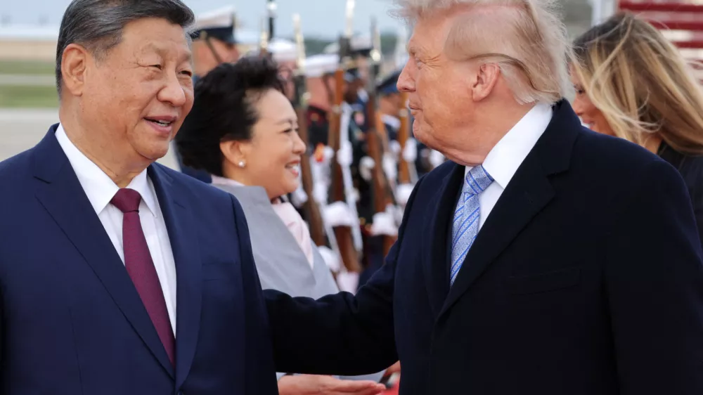 US President Donald Trump and Chinese President Xi Jinping speak as Xi arrives ahead of a state visit at Joint Base Andrews, Maryland, US, September 23, 2026. REUTERS/Jonathan Ernst