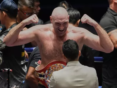 FILE - Tyson Fury, of England celebrates after winning against Mariusz Wach of Poland during a heavyweight charity bout at Max Muay Thai Stadium in Pattaya, Thailand, Friday, July 24, 2026. (AP Photo/Sakchai Lalit, File)