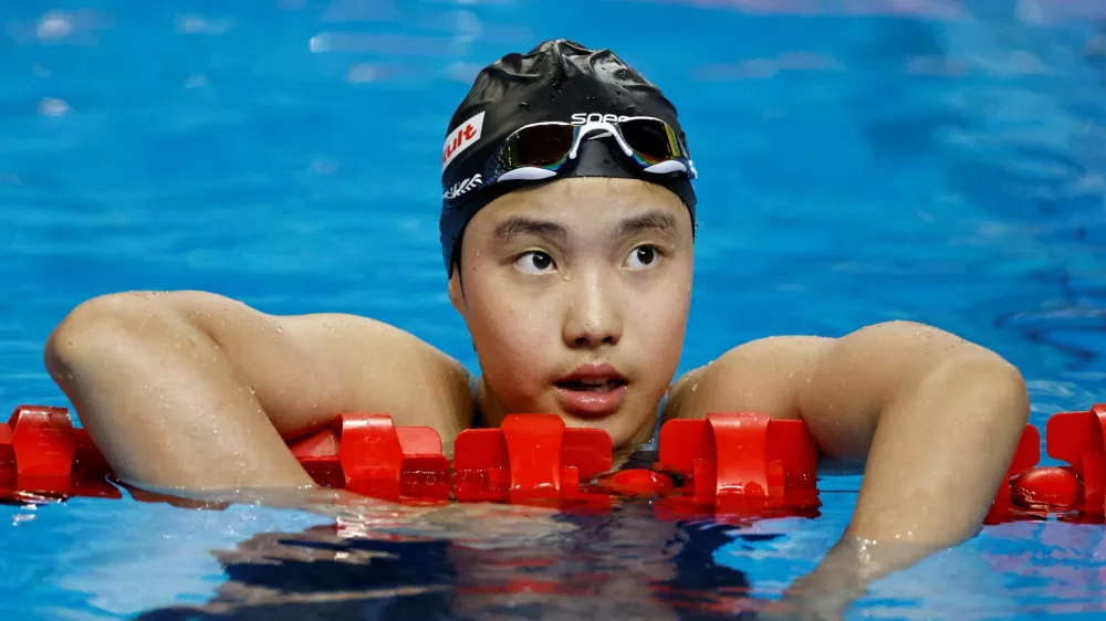 FILE PHOTO: Swimming - World Aquatics Championships - Women 400m Medley - World Aquatics Championships Arena, Singapore - August 3, 2025 China's Zidi Yu reacts at the end of heat 2 REUTERS/Tingshu Wang/File Photo / Foto: Tingshu Wang
