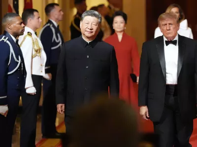 President Donald Trump arrives with China's President Xi Jinping and first lady Melania Trump and Peng Liyuan during a State Dinner for China's President Xi Jinping in the East Room of the White House, Thursday, Sept. 24, 2026, in Washington. (AP Photo/Alex Brandon)