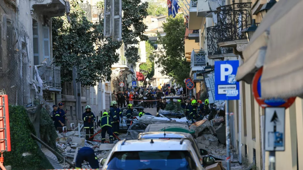 Emergency personnel work at the site where an old building partially collapsed following an explosion, at the touristy Plaka area in central Athens, Greece, September 25, 2026. REUTERS/Louisa Gouliamaki