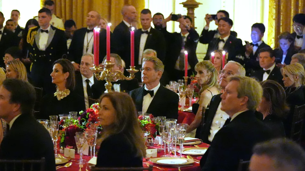 Treasury Secretary Scott Bessent and other guests listen as President Donald Trump hosts a State Dinner for China's President Xi Jinping in the East Room of the White House, Thursday, Sept. 24, 2026, in Washington. (AP Photo/Alex Brandon)