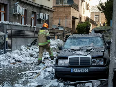 A firefighter walks at the site of a Russian drone strike, amid Russia's attack on Ukraine, in Kyiv, Ukraine September 25, 2026. REUTERS/Gleb Garanich