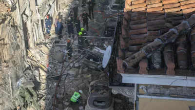 Emergency personnel work at the site where an old building partially collapsed following an explosion, at the touristy Plaka area in central Athens, Greece, September 25, 2026. REUTERS/Louisa Gouliamaki