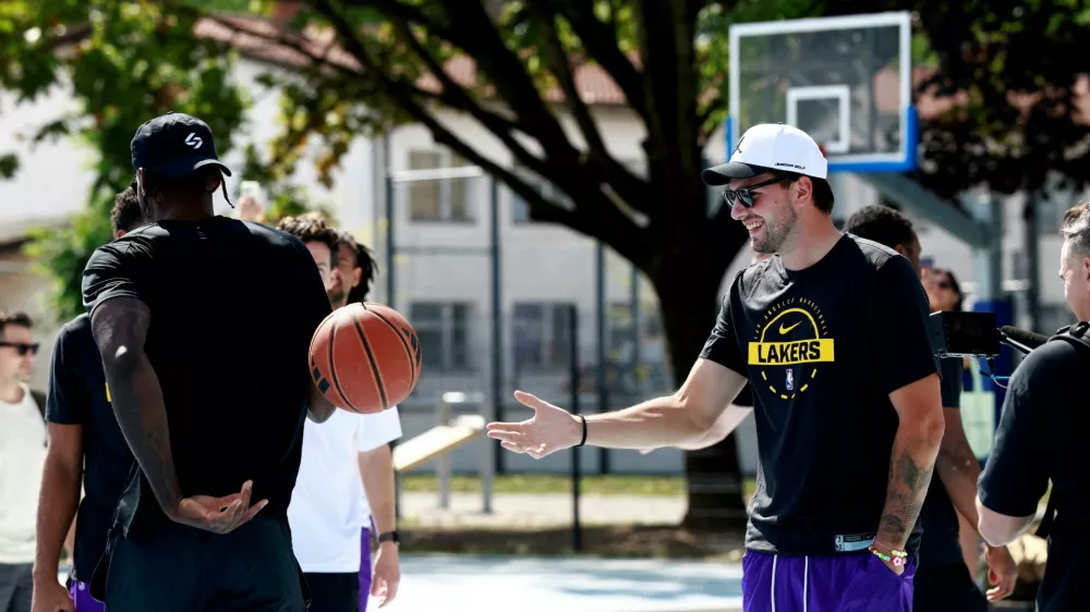 Basketball - NBA - Los Angeles Lakers visit to Ljubljana - Ljubljana, Slovenia - August 23, 2026 Los Angeles Lakers' Luka Doncic on the court where he played growing up in Ljubljana REUTERS/Borut Zivulovic