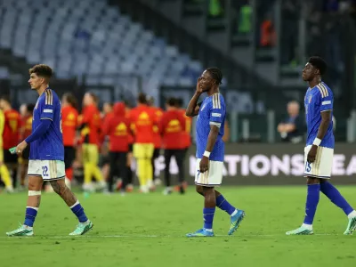 Soccer Football - Nations League - Group A - Italy v Belgium - Stadio Olimpico, Rome, Italy - September 25, 2026 Italy's Giovanni Di Lorenzo, Issa Doumbia and Mohamed Ali Zoma look dejected after the match REUTERS/Ciro De Luca