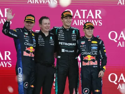 Formula One F1 - Azerbaijan Grand Prix - Baku City Circuit, Baku, Azerbaijan - September 26, 2026 Mercedes' George Russell celebrates on the podium after winning the race with second placed Red Bull's Max Verstappen and third placed Red Bull's Isack Hadjar REUTERS/Ramil Sitdikov