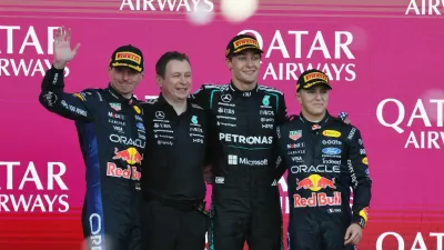 Formula One F1 - Azerbaijan Grand Prix - Baku City Circuit, Baku, Azerbaijan - September 26, 2026 Mercedes' George Russell celebrates on the podium after winning the race with second placed Red Bull's Max Verstappen and third placed Red Bull's Isack Hadjar REUTERS/Ramil Sitdikov