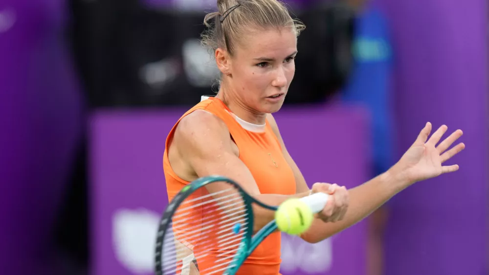 FILE -Tatiana Prozorova of Russia returns a shot to Barbora Krejcikova of the Czech Republic during the first round match of the Korea Open tennis championships at Seoul Olympic Park Tennis Center in Seoul, South Korea, Sept. 16, 2025. (AP Photo/Ahn Young-joon, File)