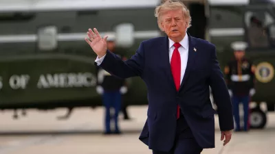 President Donald Trump waves as he walks from Marine One to board Air Force One, Saturday, Sept. 26, 2026, at Joint Base Andrews, Md. (AP Photo/Julia Demaree Nikhinson)