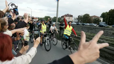 People welcome a group of university students at the end of their cycling tour of the Balkan country ahead of an early election next month challenging populist President Aleksandar Vucic, in Kragujevac, Serbia, Saturday, Sept. 26, 2026. (AP Photo/Marko Drobnjakovic)