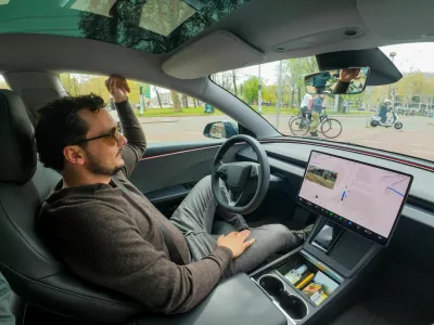 FILE PHOTO: Tesla enthusiast Kees Roelandschap drives around hands-free with his electric car, several days after Dutch regulators approved the use of Tesla's self-driving software, in Amsterdam, Netherlands, April 17, 2026. REUTERS/Bart Biesemans/File Photo