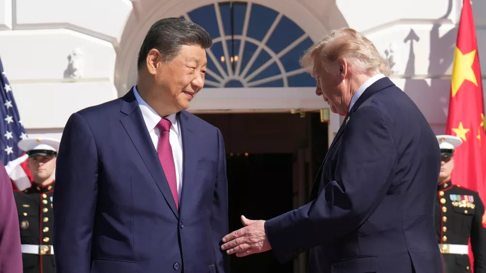 President Donald Trump, right, greets China's President Xi Jinping upon arrival at the South Portico of the White House, Friday, Sept. 25, 2026, in Washington. (AP Photo/Jacquelyn Martin)
