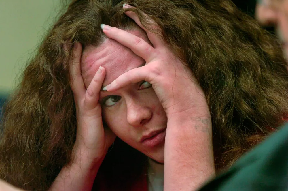 June 11, 2021; Knoxville, TN, USA;Convicted Job Corps killer Christa Gail Pike returned to a Knox County courtroom today for a second chance at appealing her conviction -- a legal maneuver she once rejected. Her mother, Carissa Hansen of Texas, was the first of seven witnesses scheduled to testify today before Criminal Court Judge Mary Beth Leibowitz. Pike listens to her mother detail Pike's difficult childhood, including her premature birth, marijuana and cocaine use and abortion. Mandatory Credit: Knoxville News Sentinel-USA TODAY NETWORK