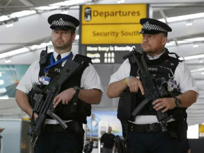 Armed police patrol at Terminal 5, Heathrow Airport in London, Britain, in this file photograph dated March 22, 2016. Facial recognition software, scanners that detect weapons and cameras that spot nervous people are some of the technologies that could be used more widely to secure public places, but some would require greater acceptance of surveillance in Europe. REUTERS/Luke MacGregor/Files