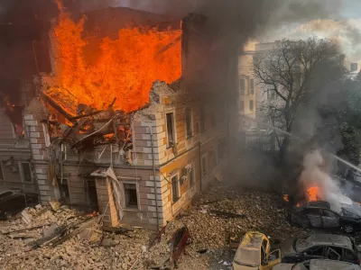 Firefighters attempt to extinguish fire at the site of the Ukraine's Academy of Sciences building hit by a Russian jet-powered drone strike, amid Russia's attack on Ukraine, in Kyiv, Ukraine, September 28, 2026. REUTERS/Sergiy Chalyi