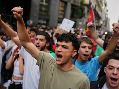 Activists protest near the Spanish Parliament following the eviction of 87-year-old Maria del Carmen Abascal to demand stronger laws to protect renters in Madrid, Spain, Friday, Oct. 2, 2026. (AP Photo/Manu Fernandez)