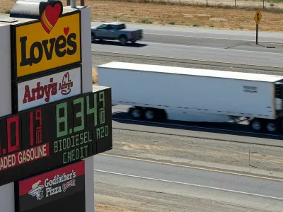 A semi drives past a sign advertising gas and diesel prices along Interstate 5 in Williams, California, U.S., September 28, 2026. REUTERS/Fred Greaves