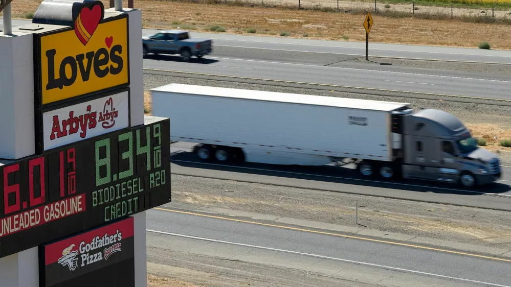 A semi drives past a sign advertising gas and diesel prices along Interstate 5 in Williams, California, U.S., September 28, 2026. REUTERS/Fred Greaves