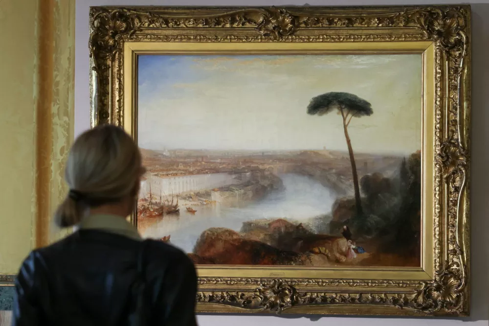 A person stands in front of William Turner's 1835 painting "Rome, from Mount Aventine", presented by Sotheby's at Palazzo Rondinini, in Rome, Italy, September 29, 2026. REUTERS/Yara Nardi
