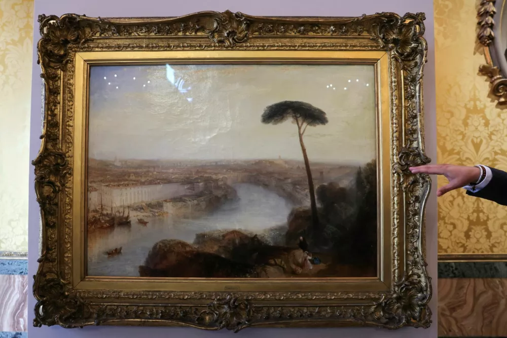 Sotheby's Senior Specialist, British Paintings, Julian Gascoigne gestures towards William Turner's 1835 painting "Rome, from Mount Aventine", presented by Sotheby's at Palazzo Rondinini, in Rome, Italy, September 29, 2026. REUTERS/Yara Nardi
