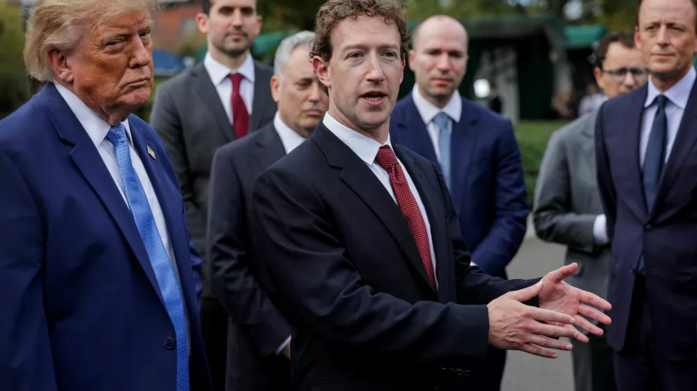 Meta CEO Mark Zuckerberg gestures, flanked by US President Donald Trump, as they speak to the press at the White House driveway following a luncheon for tech leaders in the East Room, in Washington, D.C., US, September 29, 2026. REUTERS/Jonathan Ernst