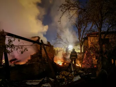 A firefighter works at the site of a private house hit by a Russian drone strike, amid Russia's attack on Ukraine, in Kyiv, Ukraine September 30, 2026. REUTERS/Gleb Garanich