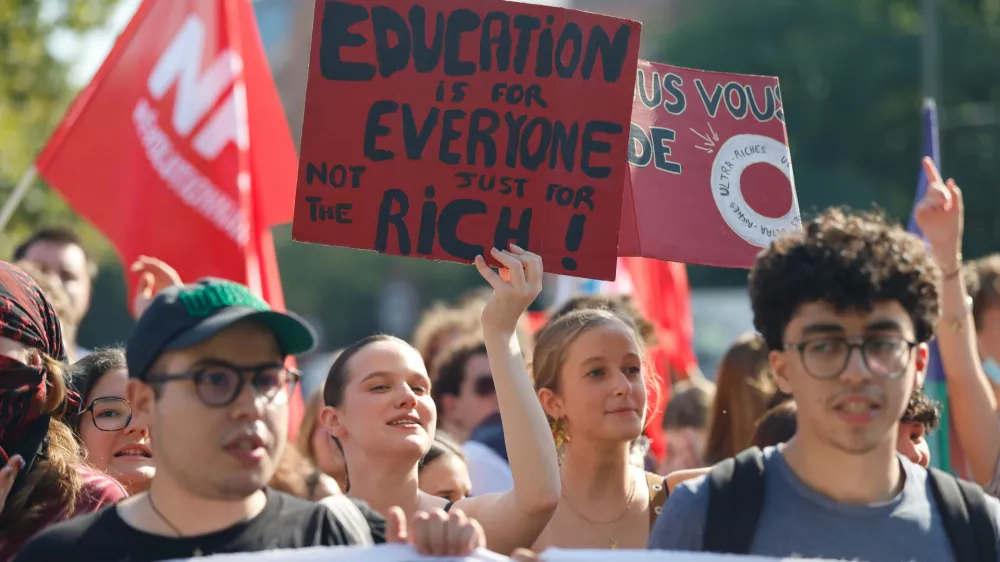 Protesters march against the government's release of next year's draft budget, in Lille, France, Tuesday, Sept. 29, 2026. (AP Photo/Jean-Francois Badias)