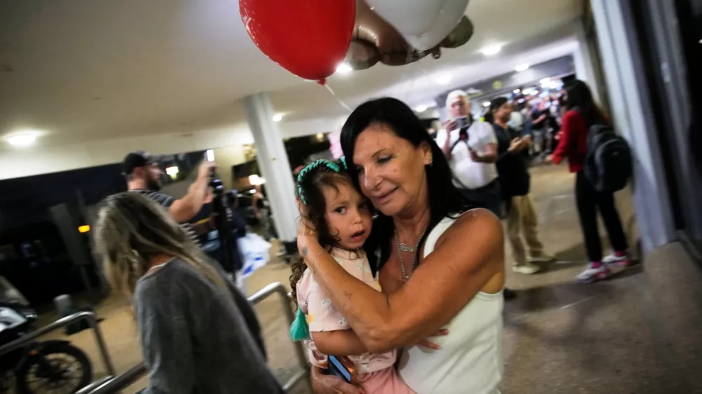 Israeli passengers who had been aboard a FlyDubai aircraft that made an emergency landing in Saudi Arabia are welcomed at the arrivals gate at Ben Gurion International Airport near Tel Aviv, Israel, Wednesday, Sept. 30, 2026. (AP Photo/Ohad Zwigenberg)