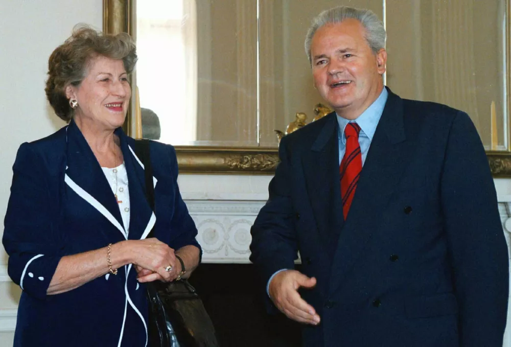 FILE - Yugoslav President Slobodan Milosevic, right, gestures while he meets Bosnian Serb President Biljana Plavsic, on Sept. 24, 1997 in Belgrade. (AP Photo, File)