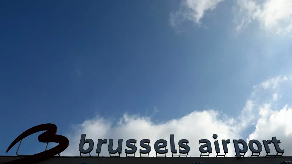 FILE PHOTO: The logo of Brussels international airport is seen outside the terminal in Zaventem, Belgium March 31, 2025. REUTERS/Yves Herman/File Photo