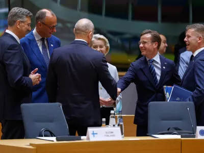 From left, Croatia's Prime Minister Andrej Plenkovic, Germany's Chancellor Friedrich Merz, Slovenia's Prime Minister Janez Jansa, European Commission President Ursula von der Leyer, Finland's Prime Minister Petteri Orpo and Hungary's Prime Minister Peter Magyar talk during a round table meeting at the EU summit in Brussels, Thursday, June 18, 2026. (AP Photo/Geert Vanden Wijngaert)