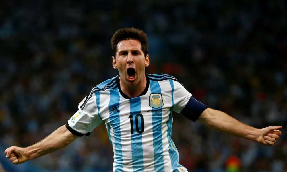 FILE PHOTO: Argentina's Lionel Messi celebrates scoring a goal during the 2014 World Cup Group F soccer match against Bosnia and Herzegovina at the Maracana stadium in Rio de Janeiro June 15, 2014. REUTERS/Michael Dalder/File Photo