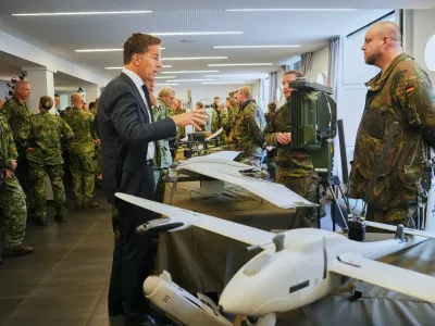 Secretary General of NATO Mark Rutte inspects military equipments during a visit of the 1. German-Netherlands Corps in Muenster, Germany, Thursday, Oct. 1, 2026. (AP Photo/Martin Meissner)