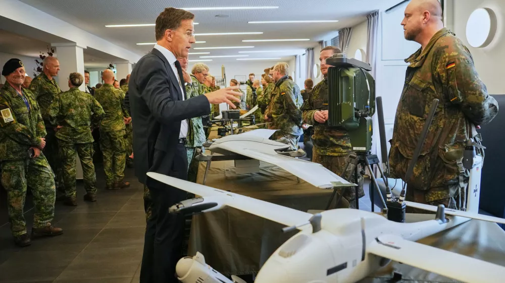 Secretary General of NATO Mark Rutte inspects military equipments during a visit of the 1. German-Netherlands Corps in Muenster, Germany, Thursday, Oct. 1, 2026. (AP Photo/Martin Meissner)