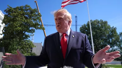 President Donald Trump speaks with reporters before boarding Marine One on the South Lawn of the White House, Thursday Oct. 1, 2026, in Washington. (AP Photo/Jacquelyn Martin)