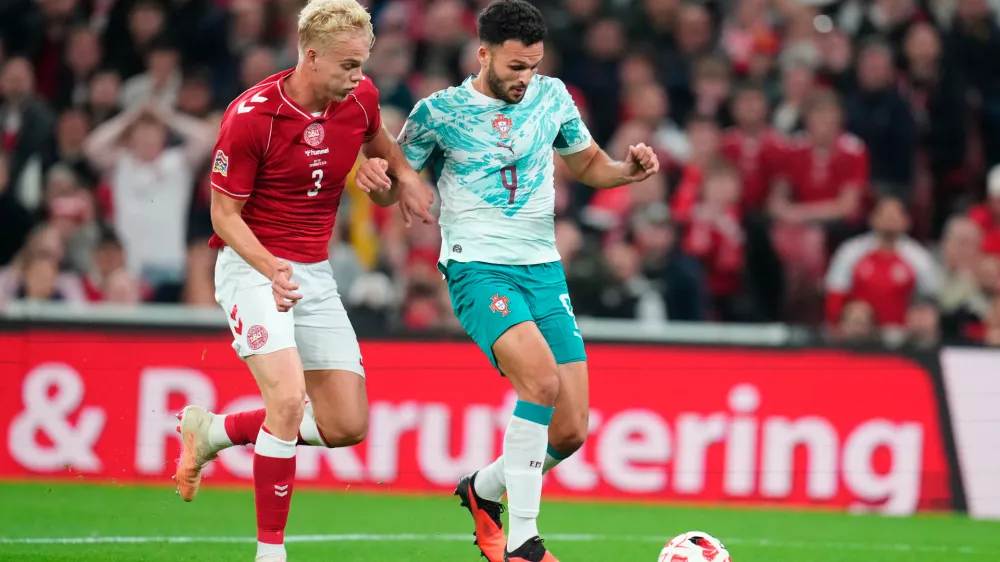 Denmark's Oliver Provstgaard, left, and Portugal's Goncalo Ramos in action during the Nations League soccer match between Denmark and Portugal, in Copenhagen, Thursday, Oct. 1, 2026. (Liselotte Sabroe/Ritzau Scanpix via AP)