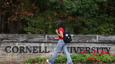 A student walks by a sign at the entrance of Cornell University in Ithaca, New York, US, October 1, 2026. REUTERS/Lauren Petracca