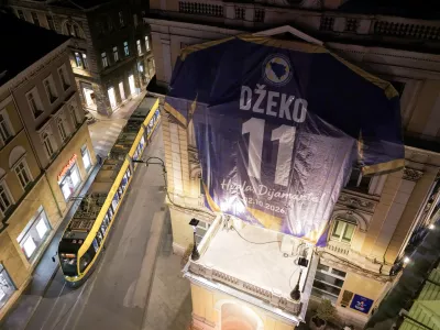 An aerial view shows a replica of Bosnia's Edin Dzeko jersey hanging on a building ahead of his final match with the national team tomorrow, in Sarajevo, Bosnia, Thursday, Oct. 1, 2026. (AP Photo/Armin Durgut)