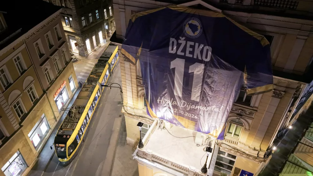An aerial view shows a replica of Bosnia's Edin Dzeko jersey hanging on a building ahead of his final match with the national team tomorrow, in Sarajevo, Bosnia, Thursday, Oct. 1, 2026. (AP Photo/Armin Durgut)