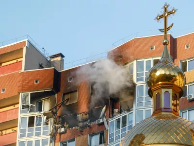 Smoke rises from an apartment building which was hit by a Russian drone strike, amid Russia's attack on Ukraine, in Kyiv, Ukraine October 2, 2026. REUTERS/Valentyn Ogirenko