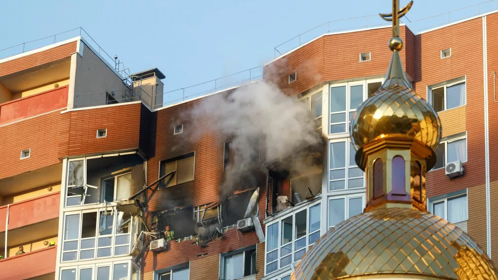 Smoke rises from an apartment building which was hit by a Russian drone strike, amid Russia's attack on Ukraine, in Kyiv, Ukraine October 2, 2026. REUTERS/Valentyn Ogirenko