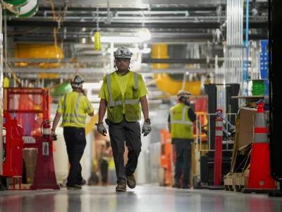 FILE PHOTO: People work inside the Microsoft data center campus' Graphical Processing Unit, currently under construction, after Microsoft's Vice Chair and President Brad Smith announced a plan to spend  billion on an additional artificial intelligence data center, in Mount Pleasant, Wisconsin, U.S., September 18, 2025. REUTERS/Audrey Richardson/File Photo/File Photo