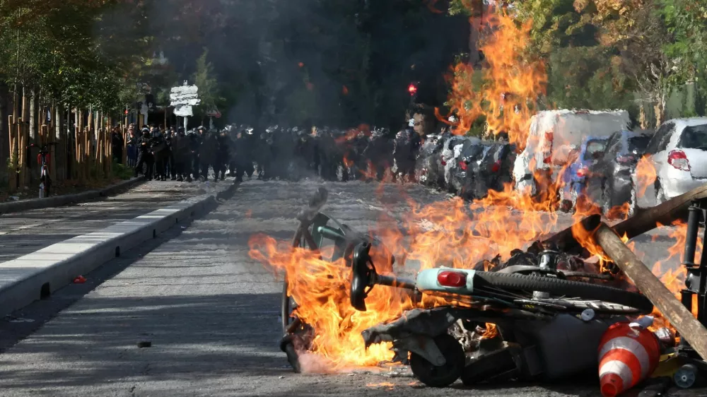 View of burning Velib bicycle, garbage bins and objects set up by high school and university students in a street amid clashes with French riot police during a student protest to demand the hiring of substitute teachers, increased resources and better learning conditions, and to support the ongoing high-school student movement in the Seine-Saint-Denis department, in Saint-Denis near Paris, France, October 1, 2026. REUTERS/Abdul Saboor