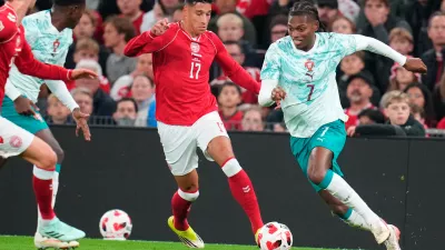 Denmark's Adam Daghim and Portugal's Rafael Leao, right, in action during the Nations League soccer match between Denmark and Portugal, in Copenhagen, Thursday, Oct. 1, 2026. (Liselotte Sabroe/Ritzau Scanpix via AP)