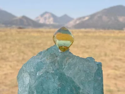 This photo provided by Jack Pearadin shows the American Dream diamond sitting on top of a large gem on Aug. 9, 2026, in Buena Vista, Colo. (Jack Pearadin via AP)