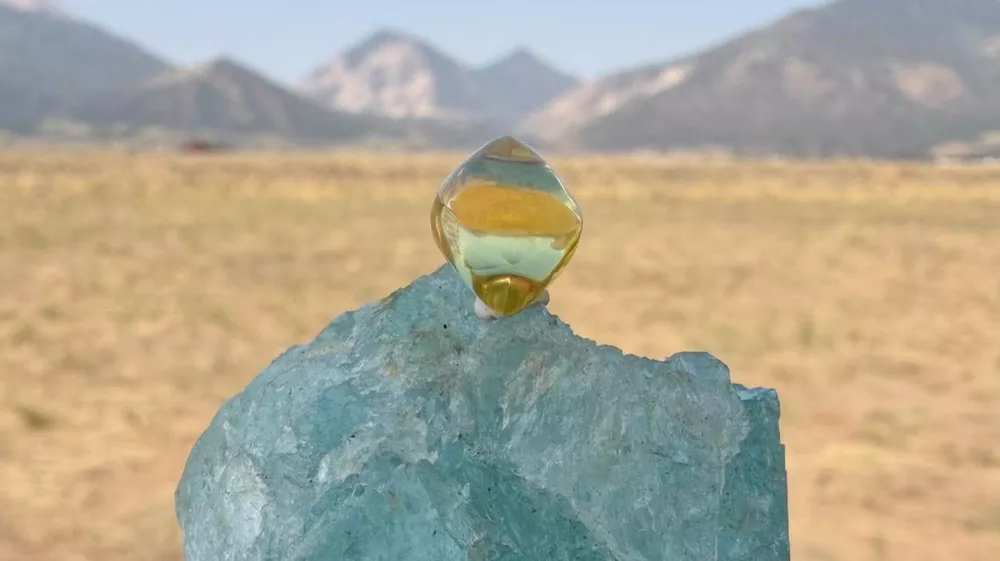 This photo provided by Jack Pearadin shows the American Dream diamond sitting on top of a large gem on Aug. 9, 2026, in Buena Vista, Colo. (Jack Pearadin via AP)