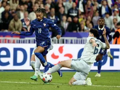 Soccer Football - Nations League - Group A1 - France v Italy - Stade de France, Saint Denis, France - October 2, 2026 France's Michael Olise in action with Italy's Alessandro Bastoni REUTERS/Catherine Steenkeste